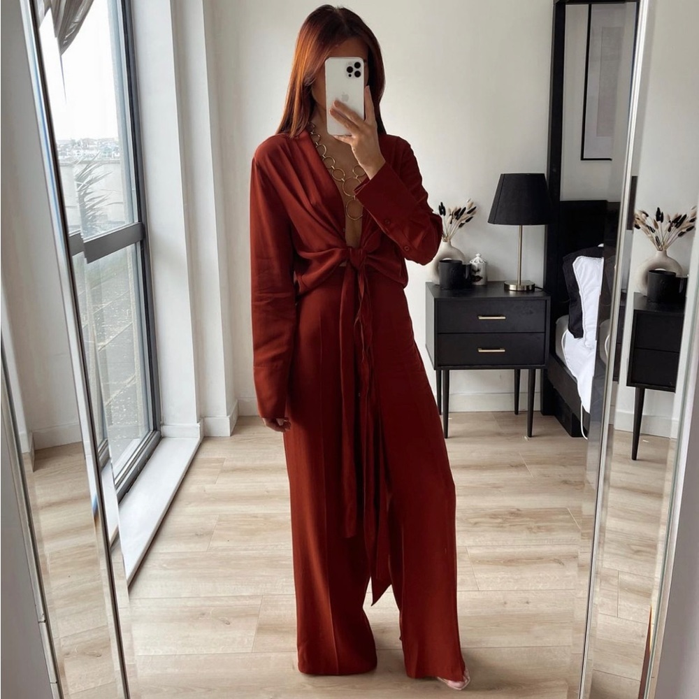 MULTI-POSITIONAL ASYMMETRIC BLOUSE